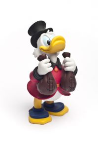 "Catania, Sicily, Italy - October 06, 2011: Studio shot of the Disney cartoon character Scrooge McDuck. This Disney toy."